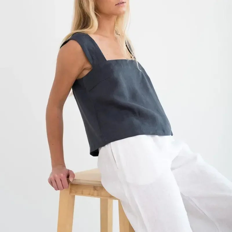 FJØRNA square neck linen cropped tank top displayed on a hanger, showcasing its lightweight, breathable fabric and modern design.