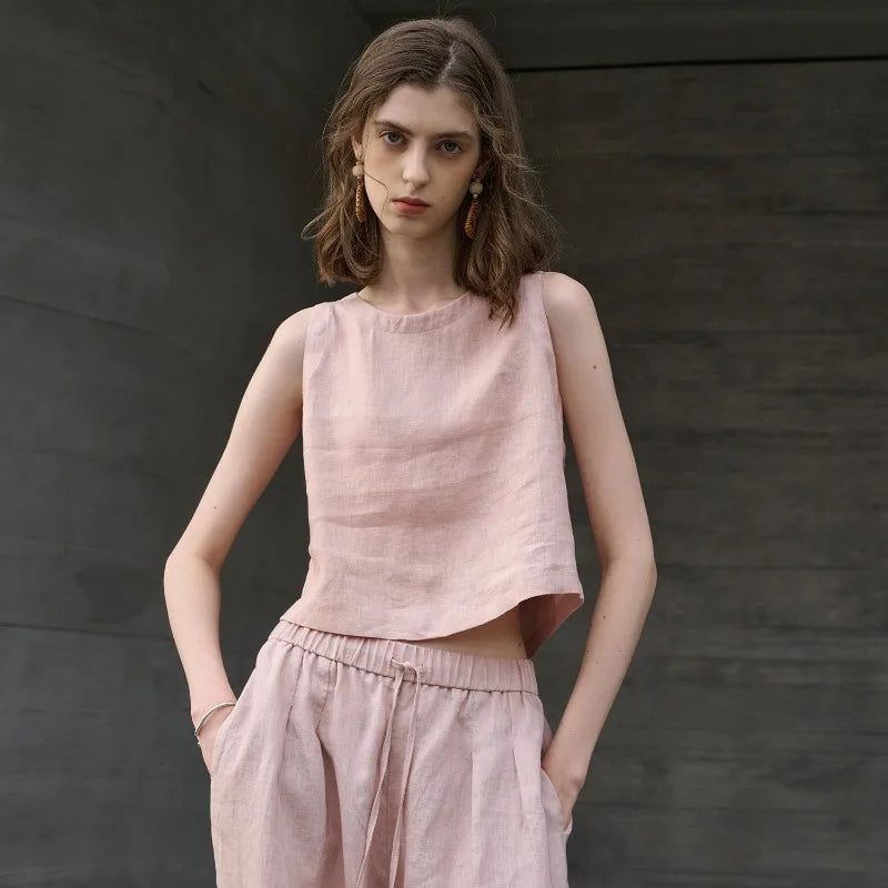 FJØRNA women's linen crop top, sleeveless design with a relaxed fit, light and breathable fabric for warm weather.