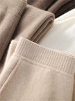 FJØRNA women's jogger pants in soft fabric, featuring a relaxed fit with elastic waistband and cuffed ankles, perfect for casual wear.