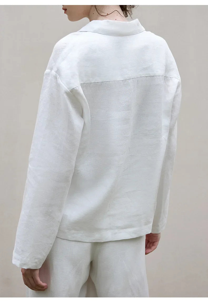 FJØRNA women's linen polo top with collar, showcasing a lightweight, breathable fabric and classic polo design.