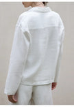 FJØRNA women's linen polo top with collar, lightweight and breathable summer blouse, shown in soft beige fabric.