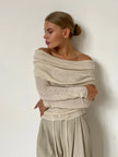Off-shoulder ribbed knit top for women by FJØRNA, featuring a fitted design and soft texture in a stylish casual look.