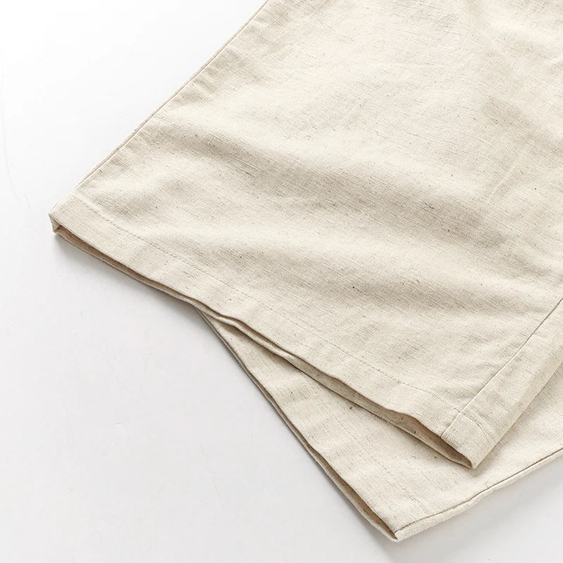 Women’s cotton linen wide-leg trousers by FJØRNA featuring a drawstring pull-on design and relaxed fit.