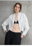 FJØRNA women's linen crop top with pleated design and long sleeves, lightweight and breathable for casual summer wear.