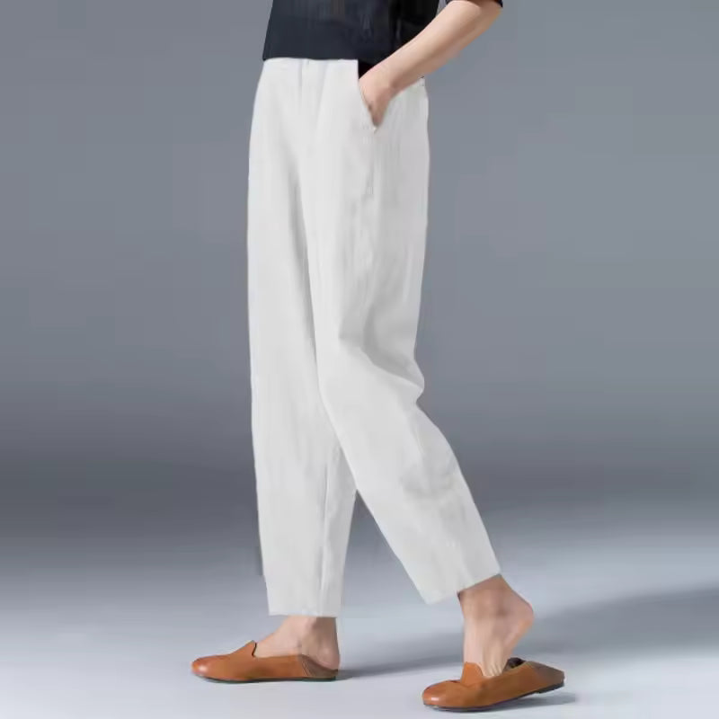 Lightweight Desiree™ summer trousers by FJØRNA, featuring relaxed fit and breathable fabric in natural outdoor setting