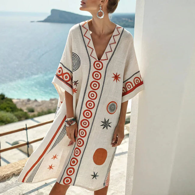 Floral V-neck flowy silk summer mini dress for women by FJØRNA, featuring a stylish floral pattern and lightweight fabric.