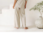 FJØRNA women’s linen wide-leg trousers with elastic waist and ruffle detail, stylish and comfortable for casual wear.