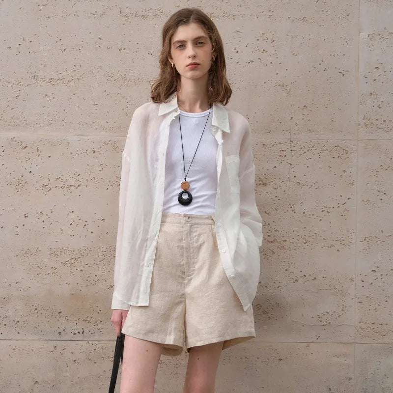 FJØRNA linen women's shirt, light and breathable top made of soft linen fabric, featuring a relaxed fit and classic design.