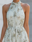 FJØRNA Fiona flowy halter maxi dress with lightweight fabric, featuring a relaxed fit and elegant design ideal for summer wear.