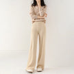 FJØRNA women's merino wool joggers with wide-leg design, soft textured knit pants for comfortable casual wear.