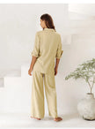 Extra-large linen shirt by FJØRNA with spacious pockets, featuring a relaxed fit and natural linen fabric for casual wear.