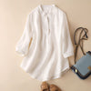 FJØRNA women's summer blouse with V-neck and linen fabric, featuring a relaxed fit and wide-leg style, perfect for warm weather.