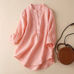 FJØRNA women's summer blouse with V-neck, linen fabric, and wide-leg design, displayed on a hanger with a neutral background.