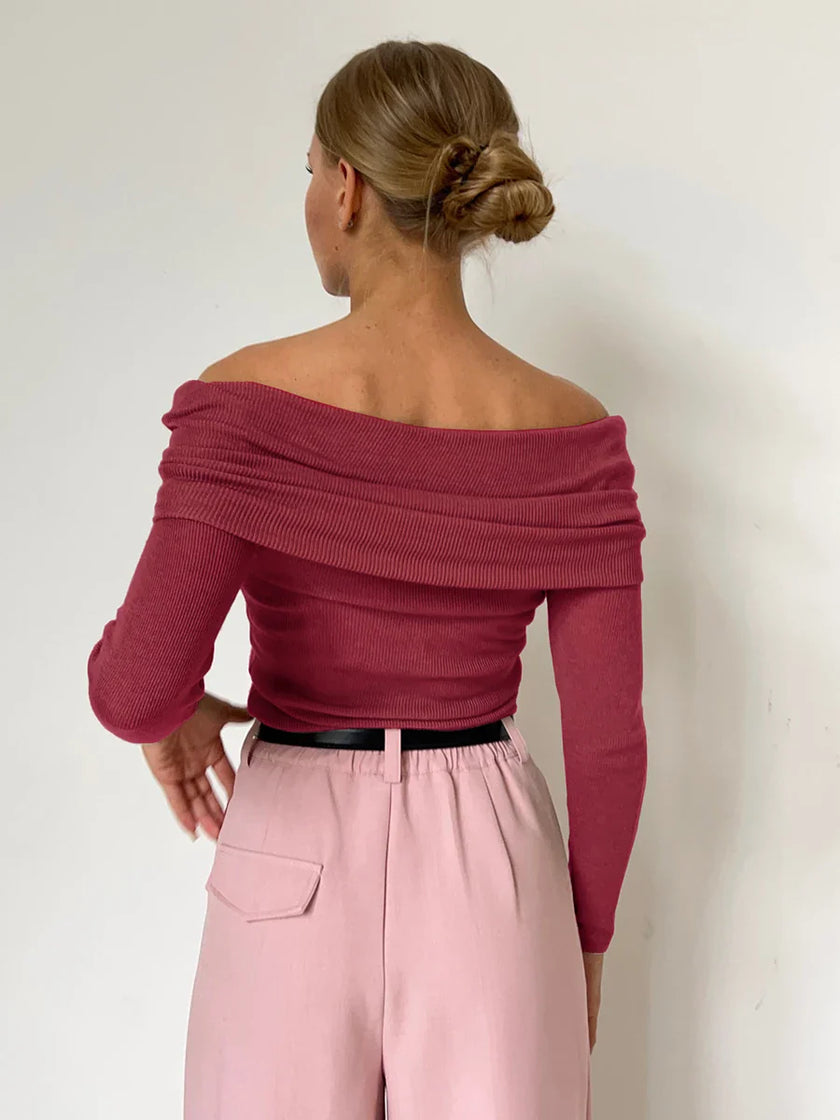 FJØRNA women's off-shoulder ribbed knit top, stylish and fitted, shown in a natural pose highlighting the textured fabric and neckline.