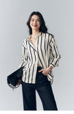 Lacceti Maren Stripe Satin Blouse with long sleeves and v-neck, featuring elegant vertical stripe pattern in satin fabric.