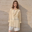 FJØRNA women's linen shirt, lightweight and breathable top, with a relaxed fit and natural fabric texture.