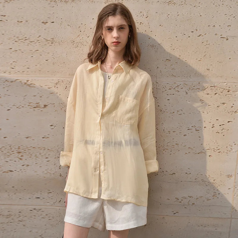 FJØRNA women's linen shirt, lightweight and breathable top, with a relaxed fit and natural fabric texture.