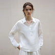 FJØRNA women's linen polo top with collar, lightweight and breathable, shown on a model.