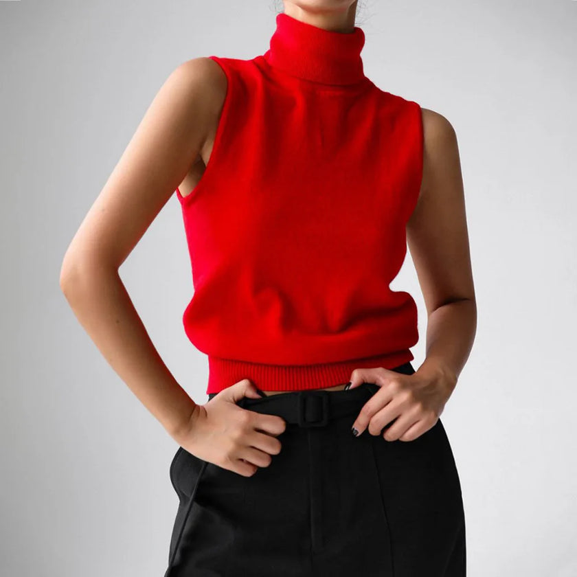 FJØRNA women's sleeveless wool vest featuring a cozy, textured knit design, ideal for layered winter or fall outfits.