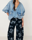 Women’s wide-leg denim jeans by FJØRNA, showcasing classic blue denim pants with a relaxed fit and stylish design.