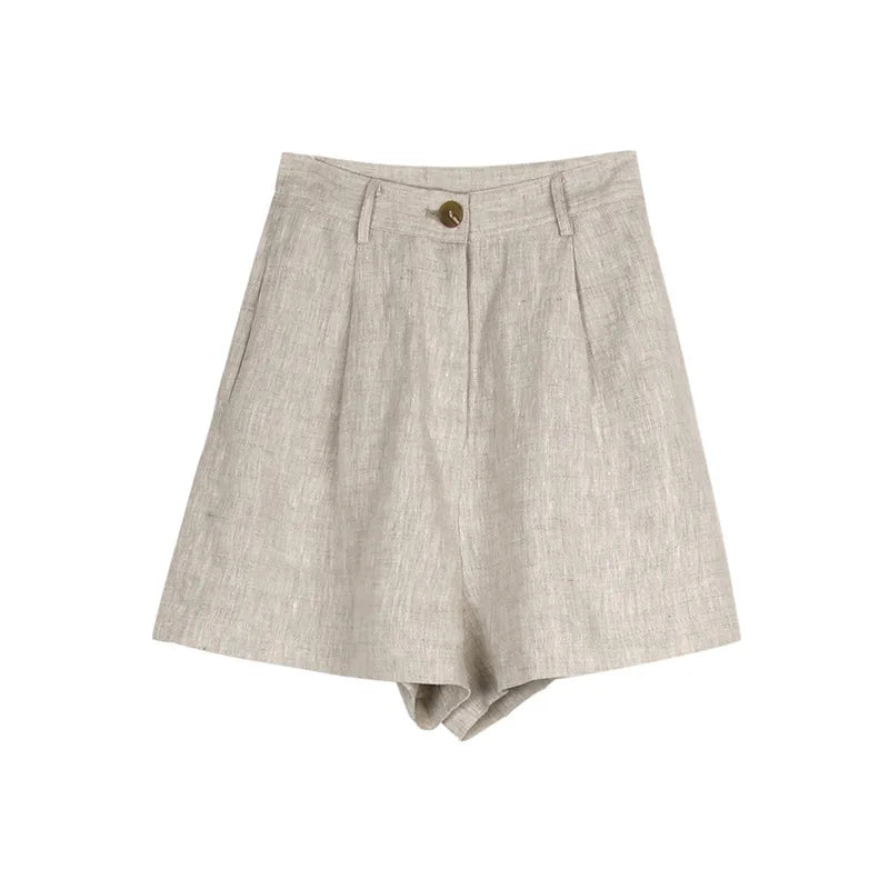 FJØRNA women's high waist linen shorts displayed on a model, showcasing the lightweight, breathable fabric and relaxed fit.