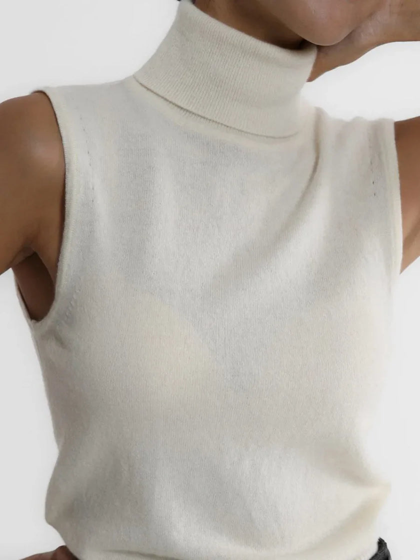 FJØRNA women's sleeveless wool vest, soft and warm, shown on a model as a stylish top for cooler weather.