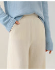 Women's Merino Wool Joggers by FJØRNA featuring wide-leg design and comfortable fit, shown in a relaxed pose.