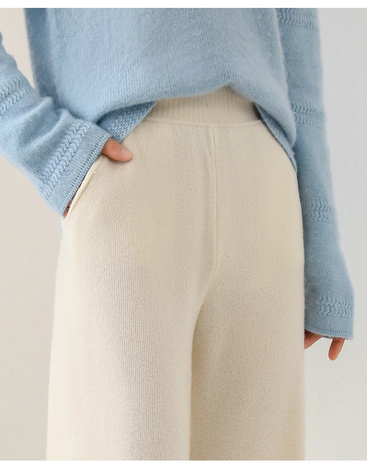 Women's Merino Wool Joggers by FJØRNA featuring wide-leg design and comfortable fit, shown in a relaxed pose.