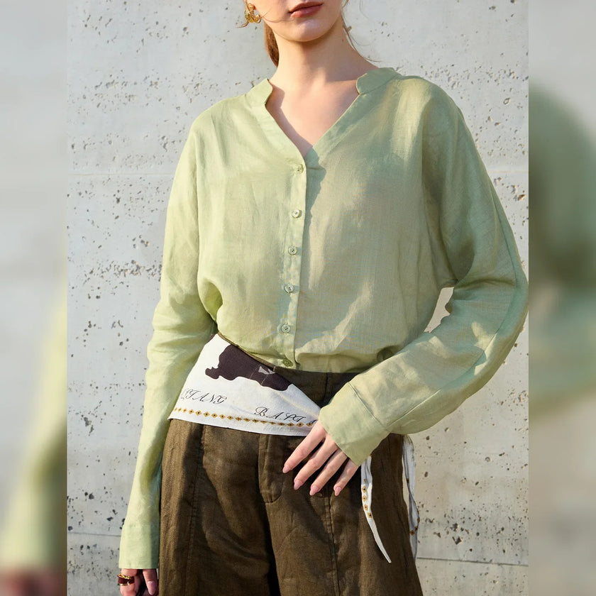 FJØRNA women's linen V-neck shirt, lightweight and breathable top with long sleeves, natural beige color, close-up fabric detail