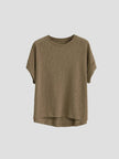 FJØRNA oversized tee with rolled cuffs, relaxed fit, soft fabric, showing the front view with rolled sleeve detail.