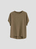 FJØRNA oversized tee with rolled cuffs, relaxed fit, soft fabric, showing the front view with rolled sleeve detail.