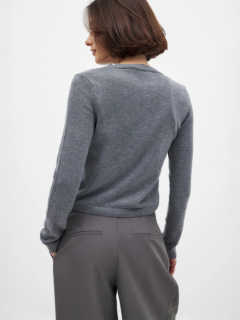 Women’s knit cardigan by FJØRNA featuring a cozy, stylish design, perfect for layering and casual wear.
