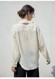 Women’s linen shirt by FJØRNA, lightweight and breathable top with a relaxed fit, shown in soft linen fabric.