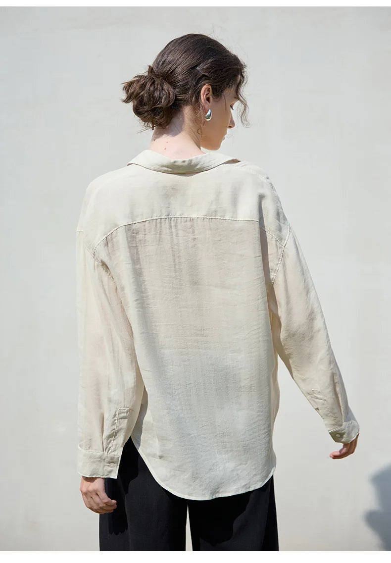 Women’s linen shirt by FJØRNA, lightweight and breathable top with a relaxed fit, shown in soft linen fabric.