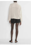 FJØRNA women's linen polo top with collar, lightweight and breathable, shown in a natural relaxed fit.
