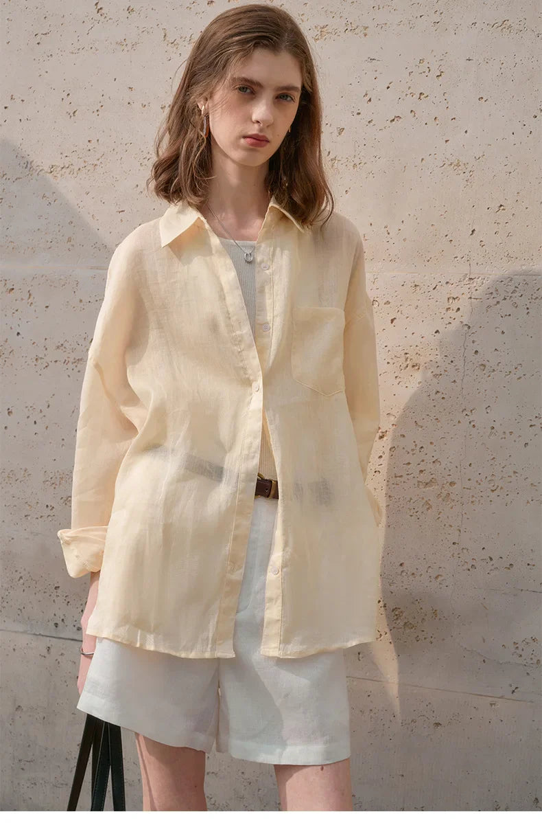 Light beige linen shirt for women by FJØRNA, featuring a relaxed fit and classic collar, perfect for casual and summer wear.