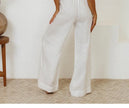 Women's linen top by FJØRNA featuring ruffle detail and lightweight, breathable fabric, ideal for casual and summer wear.