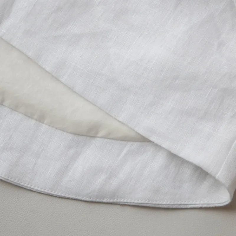 FJØRNA women's linen crop top featuring a lightweight, breathable fabric with a stylish, fitted design and short sleeves.