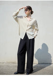 FJØRNA women's linen shirt, lightweight and breathable top, shown in a natural relaxed fit with long sleeves and classic collar.