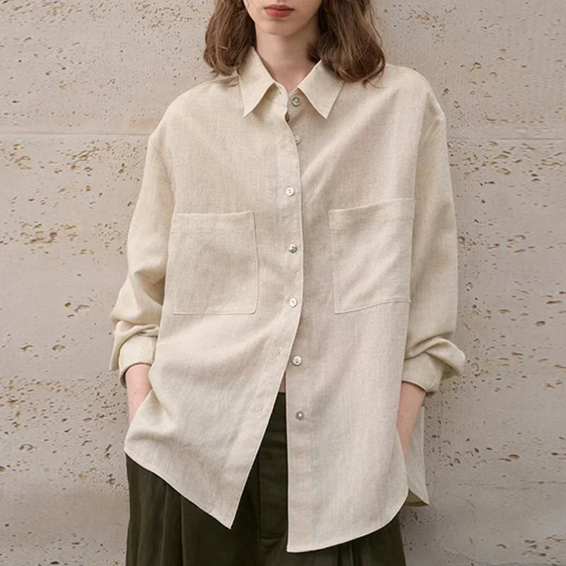FJØRNA extra-large linen shirt with spacious pockets, featuring a relaxed fit and lightweight, breathable fabric for casual wear.
