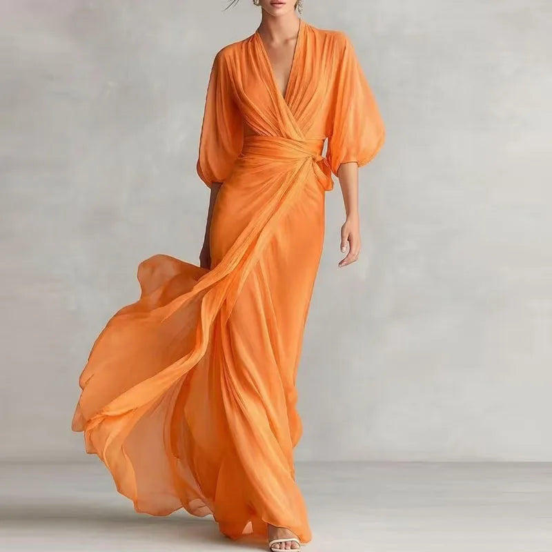 Powder blue FJØRNA dress featuring a flowy design and elegant fit, perfect for casual or semi-formal occasions.