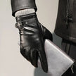 FJØRNA men's sheepskin leather gloves showing soft, brown leather with detailed stitching and a snug fit for stylish warmth.