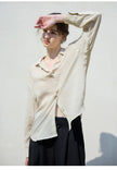 Women's linen shirt by FJØRNA, light and breathable tops, featuring a relaxed fit and natural linen fabric.