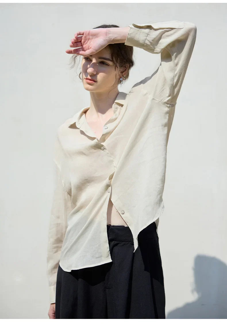 Women's linen shirt by FJØRNA, light and breathable tops, featuring a relaxed fit and natural linen fabric.