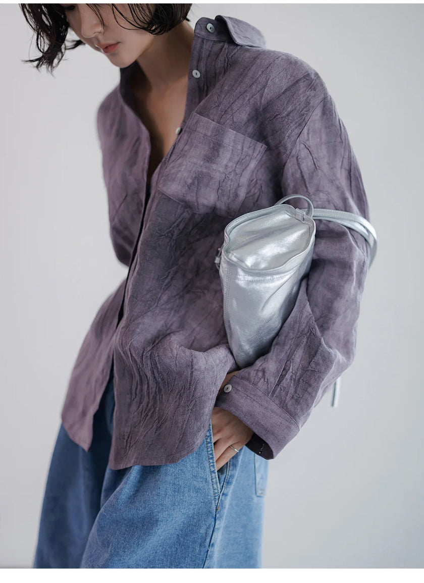 FJØRNA women's linen pleated shirt, light and breezy, featuring a relaxed fit with pleats and long sleeves, perfect for casual wear.