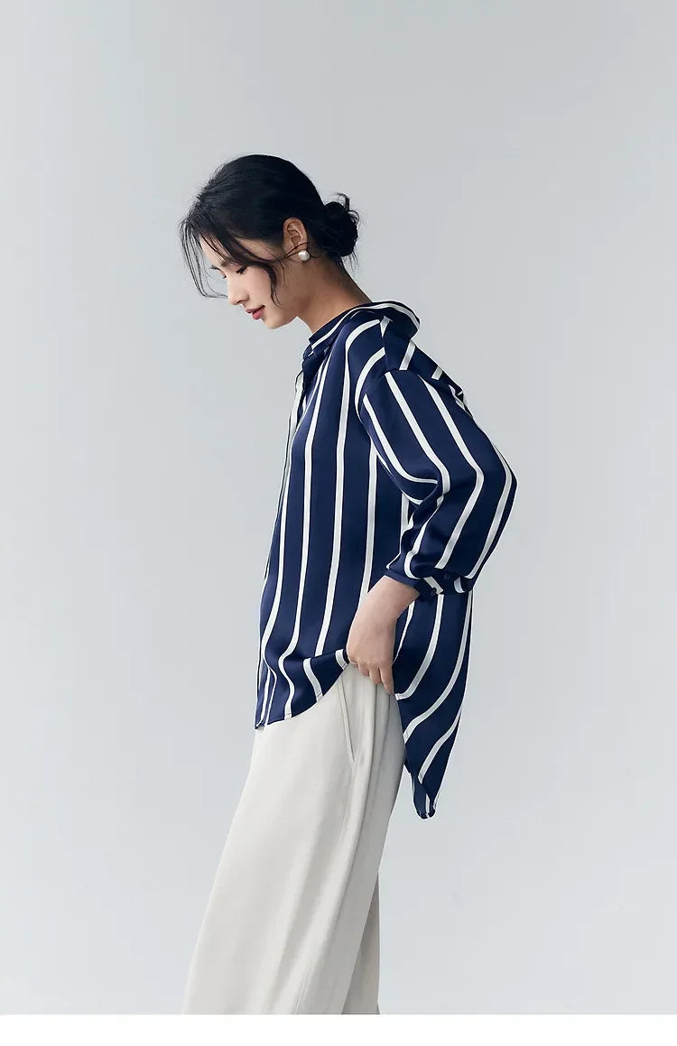 Lacceti Maren Stripe Satin Blouse featuring a classic striped pattern and satin fabric, styled with long sleeves and a relaxed fit.