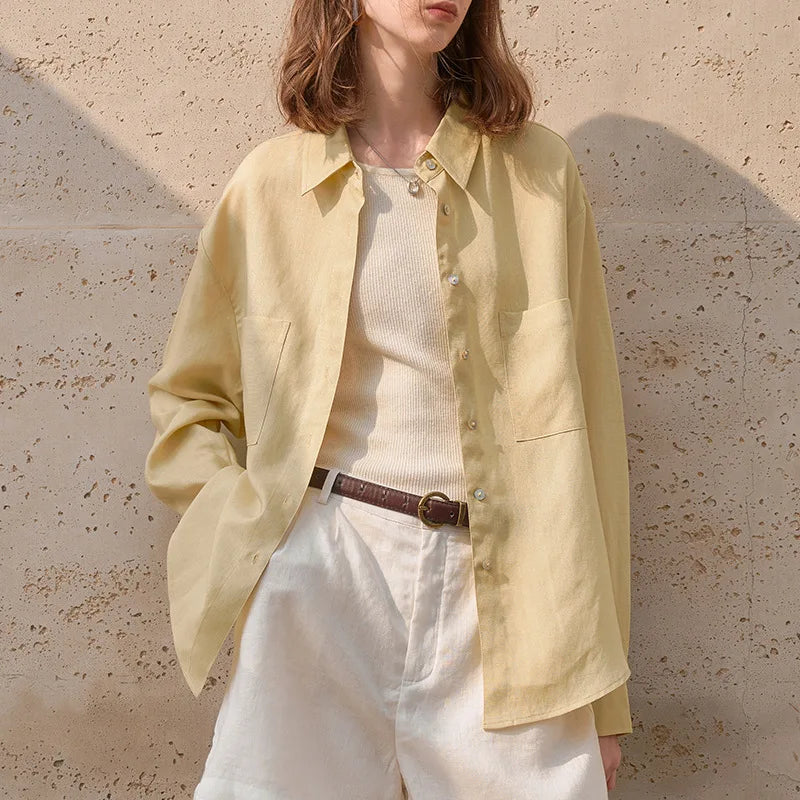 Extra-large linen shirt by FJØRNA featuring spacious pockets, lightweight fabric, and a relaxed fit in natural linen material.
