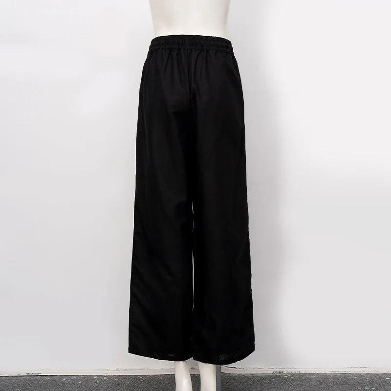FJØRNA cotton linen wide-leg women's trousers with drawstring pull-on design, showcasing relaxed fit and casual style.