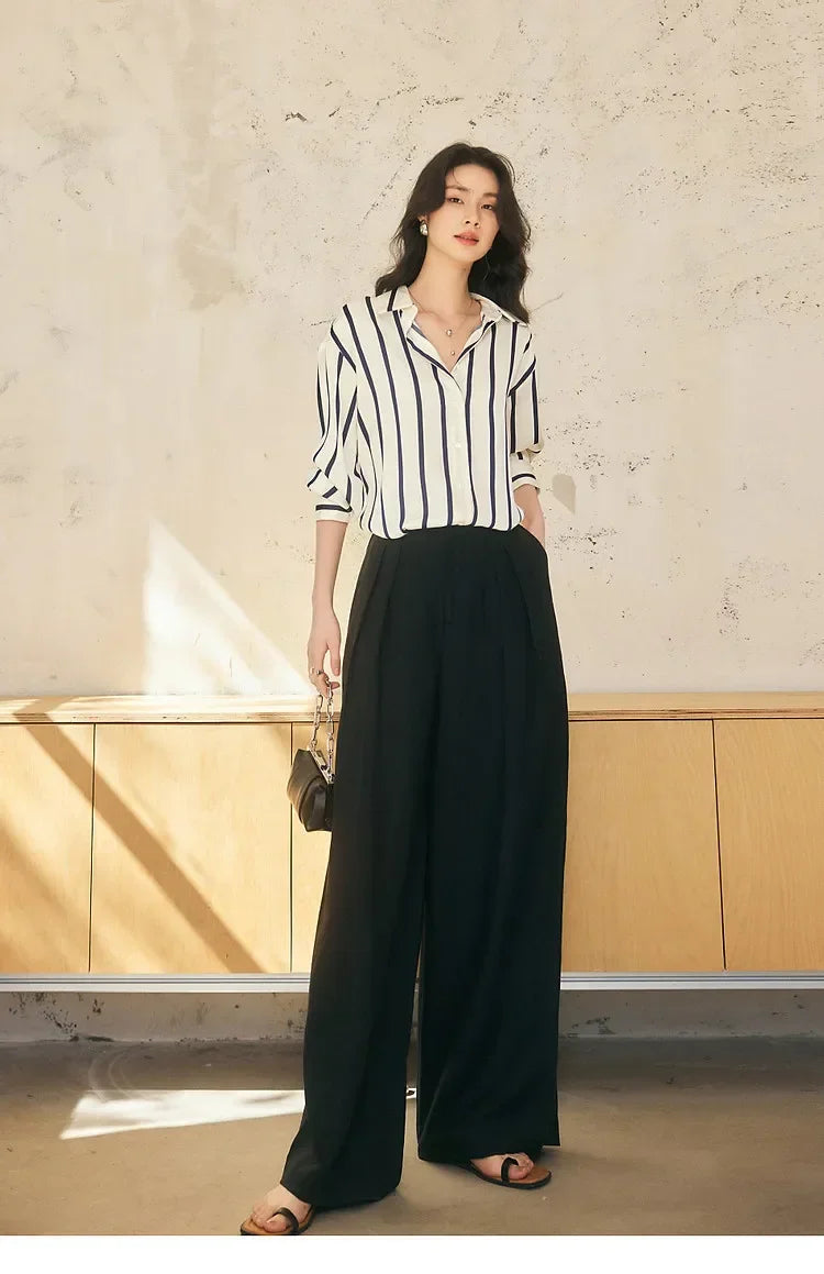 Lacceti Maren Stripe Satin Blouse featuring blue and white horizontal stripes, with a relaxed fit and elegant satin fabric.