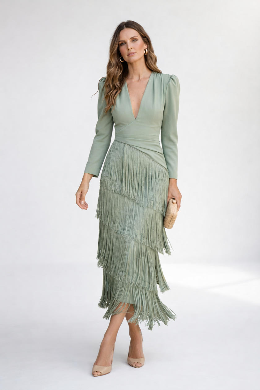 Elegant white FJØRNA midi dress with fringes, featuring a stylish design and flowing silhouette, perfect for sophisticated occasions.